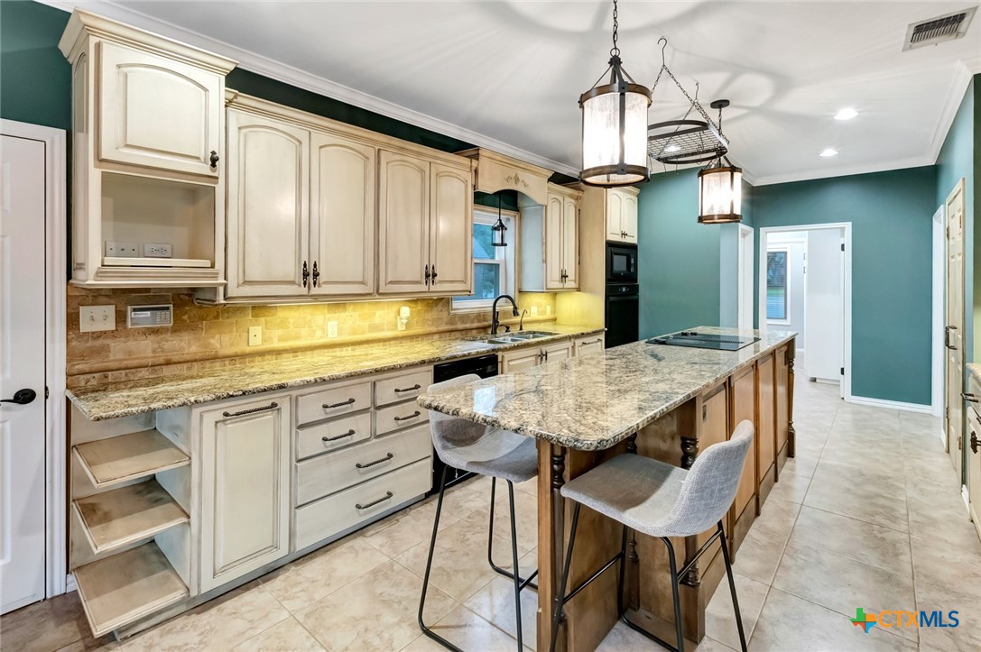 107 Masters Court Victoria, TX 77904 - Photo 14 of 48 Exit door to Garage off Kitchen