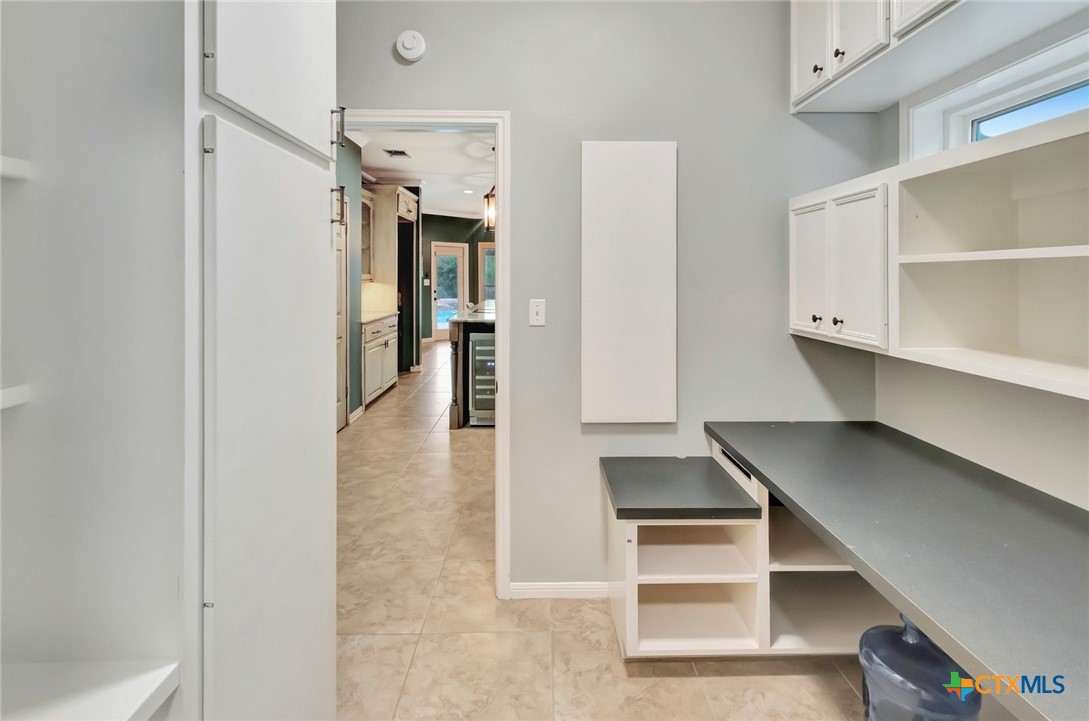 107 Masters Court Victoria, TX 77904 - Photo 18 of 48 Workspace area with fold down ironing board and room for an extra Refrigerator or Freezer