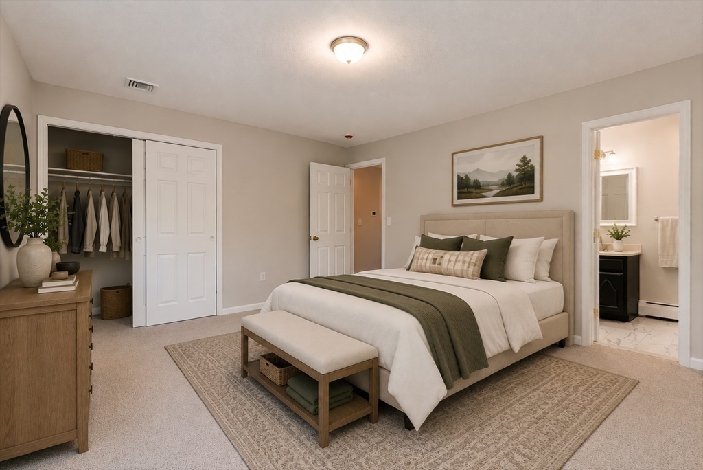 41 Watuppa Road Westport, MA 02790 - Photo 27 of 42 a spacious bedroom with a bed and a couch