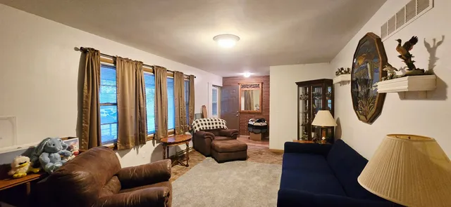 a bathroom with a toilet a sink and a shower