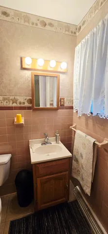 a bed room with a bed a television and furniture