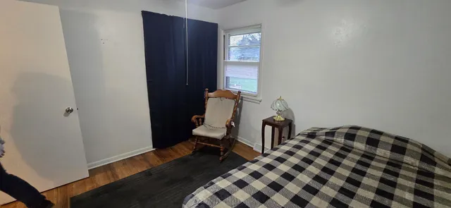 a bedroom with a bed and a closet