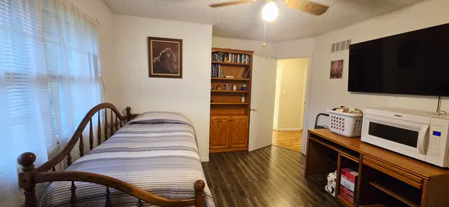 a kitchen with stainless steel appliances granite countertop a sink and cabinets