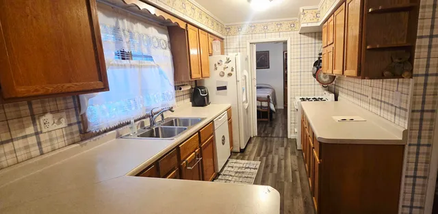a bathroom with sink a mirror and a bathtub