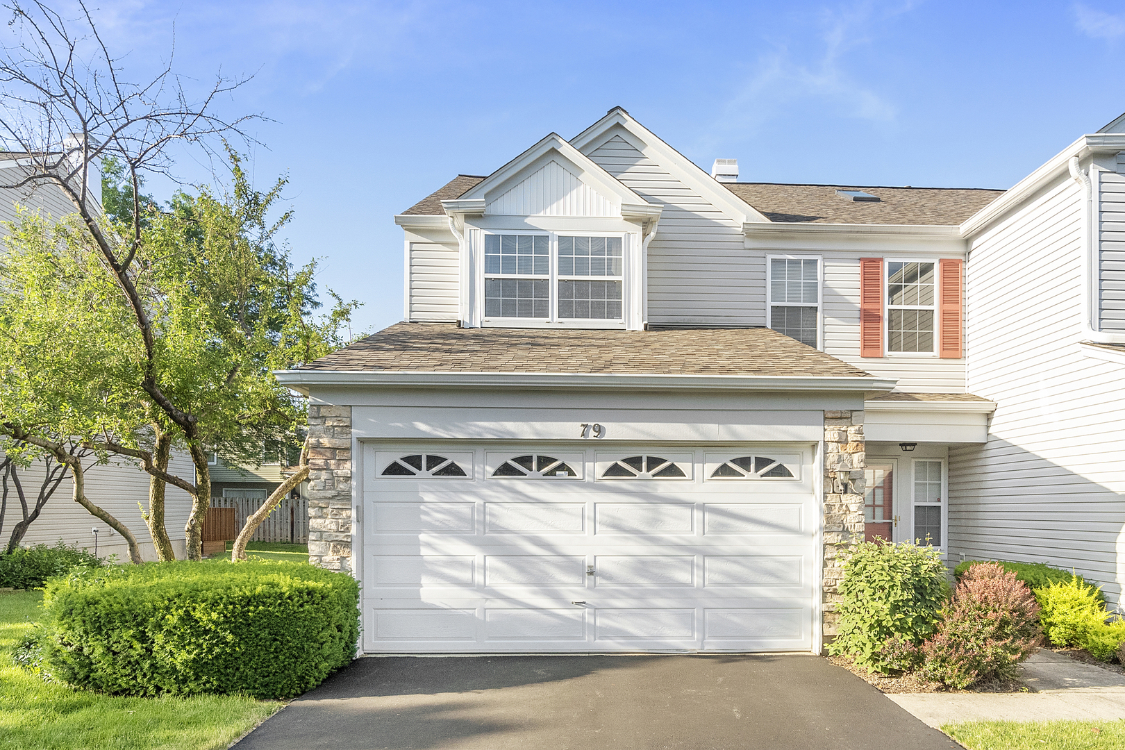 79 Oakton Drive Lombard, IL 60148 - Photo 1 of 18 a front view of a house with garden