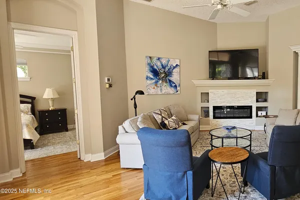 a kitchen with stainless steel appliances a sink and large windows