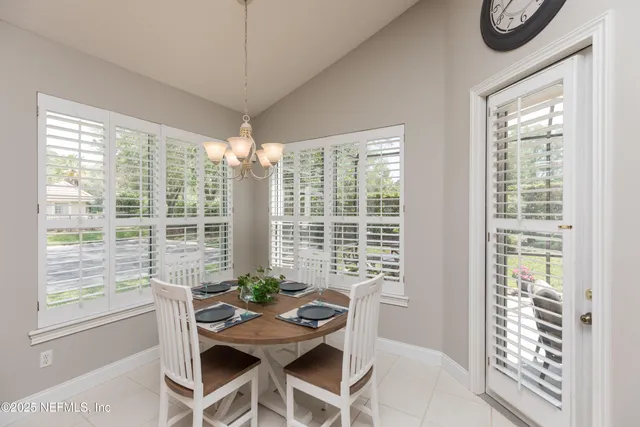 a kitchen with stainless steel appliances granite countertop sink stove and refrigerator