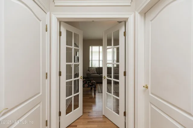 a spacious bathroom with a granite countertop sink a toilet and a mirror