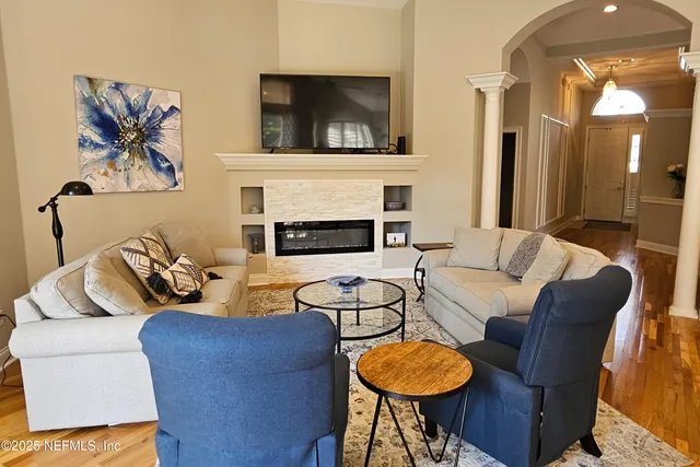 a living room with furniture and a fireplace