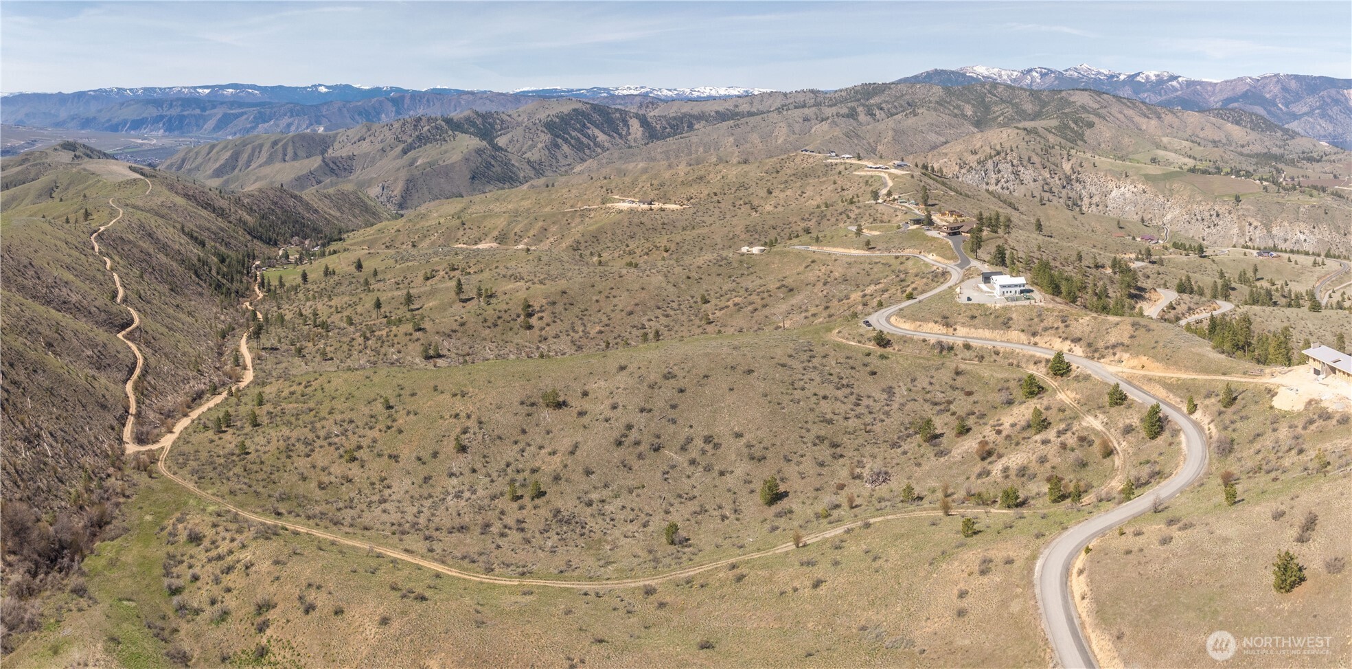 295 Hawks Ridge Road Chelan, WA 98816 - Photo 18 of 31 a view of a dry field with mountains in the background