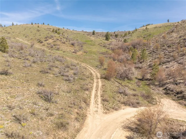 a view of a large mountain with a mountain in the background