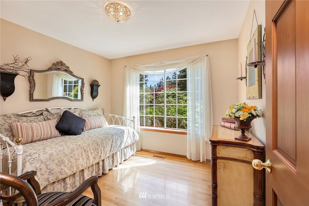 4933 211th Street Southeast Bothell, WA 98021 - Photo 14 of 25 a bedroom with a bed and a window