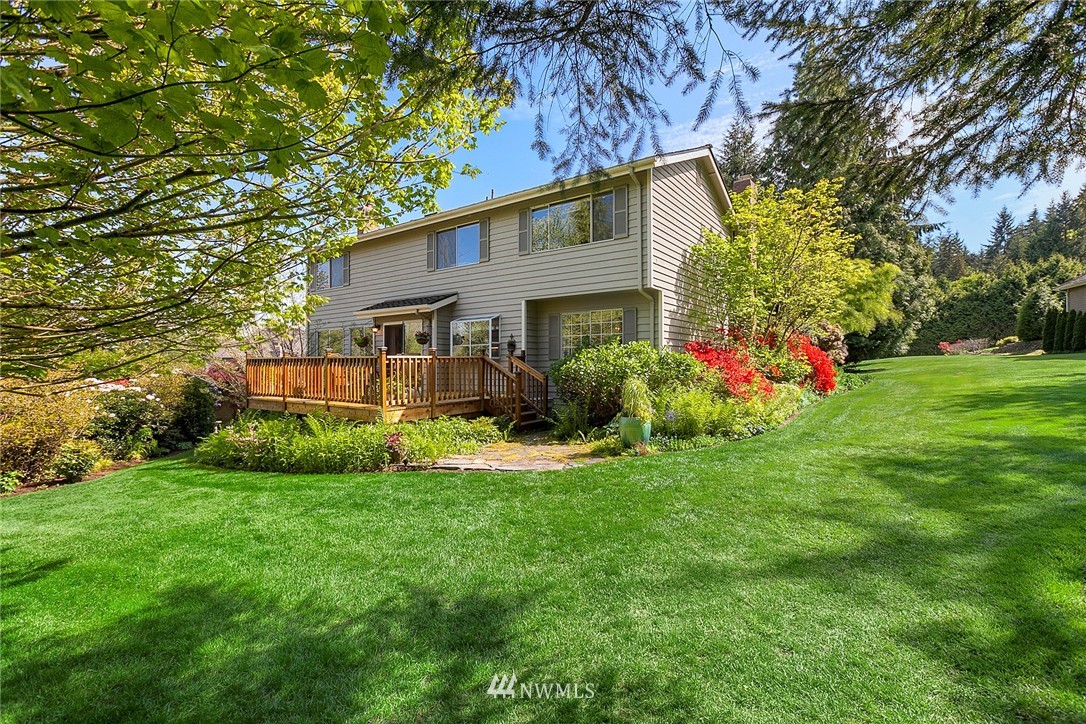4933 211th Street Southeast Bothell, WA 98021 - Photo 3 of 25 a front view of house with yard and green space