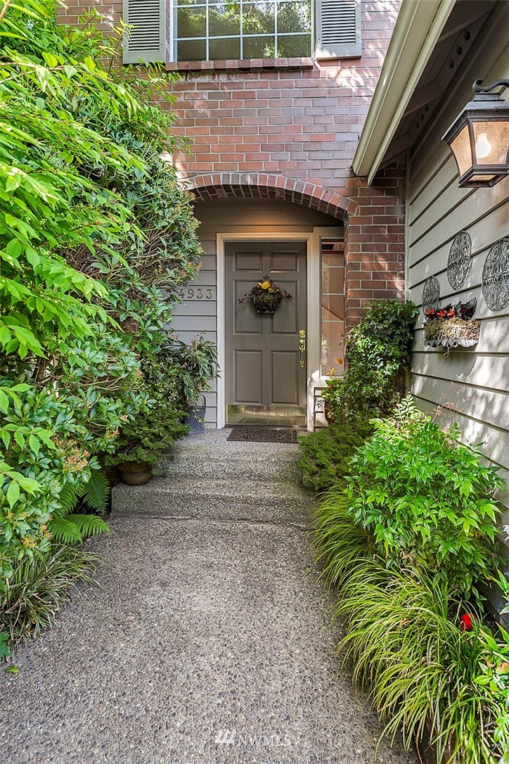4933 211th Street Southeast Bothell, WA 98021 - Photo 23 of 25 a view of a house with a small yard and plants