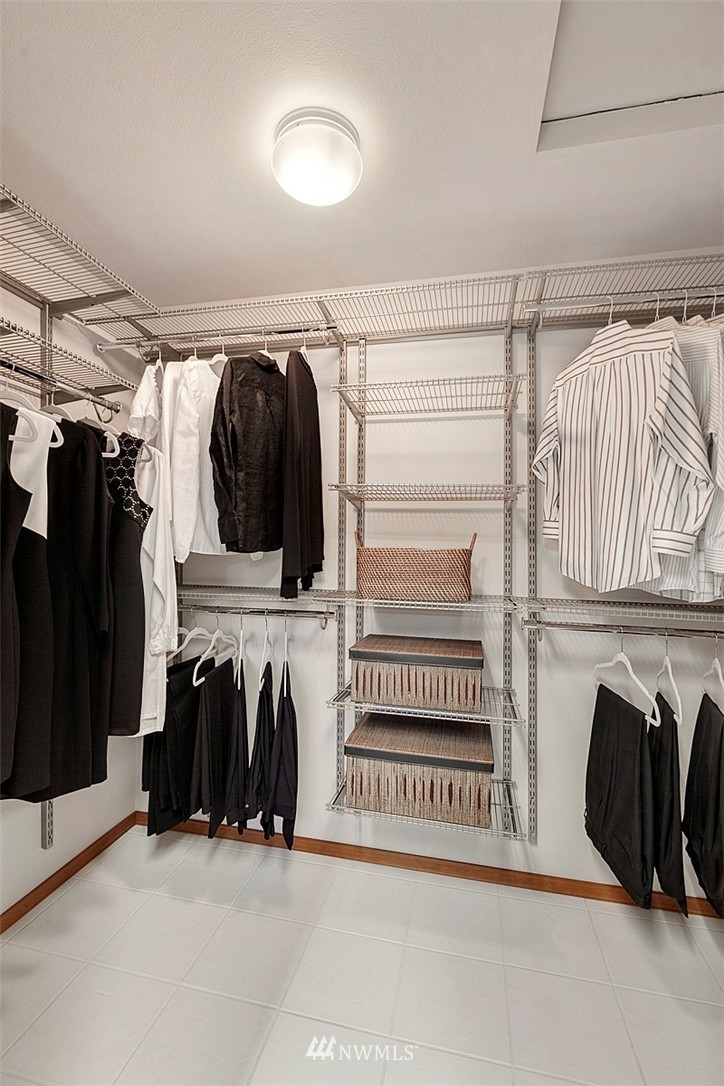 4933 211th Street Southeast Bothell, WA 98021 - Photo 9 of 25 a view of walk in closet with clothes and shoes