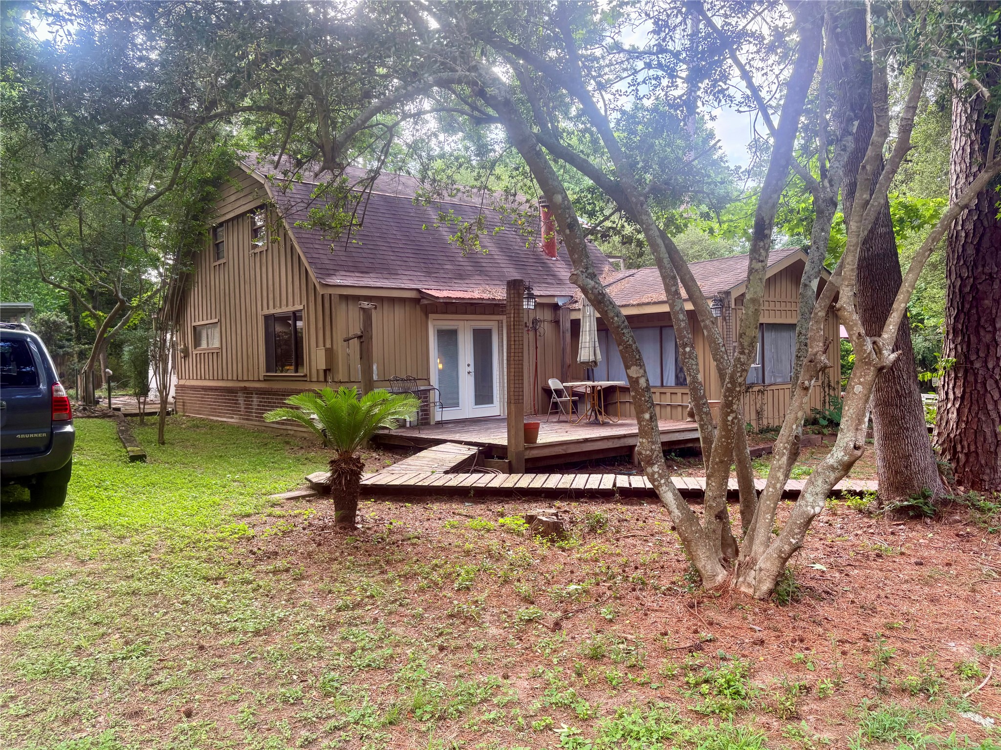 12505 Rollingwood Loop Conroe, TX 77303 - Photo 7 of 24 a house view with a garden space