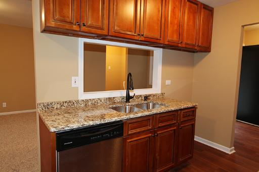 81 Seabury Road Bolingbrook, IL 60440 - Photo 3 of 10 a kitchen with granite countertop a sink and cabinets