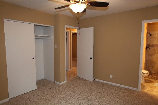 81 Seabury Road Bolingbrook, IL 60440 - Photo 5 of 10 a view of a room with a chandelier fan and a closet