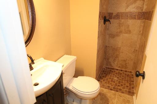 81 Seabury Road Bolingbrook, IL 60440 - Photo 6 of 10 a bathroom with a toilet and a shower curtain