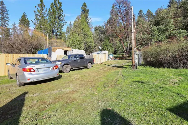 a view of a yard with swings