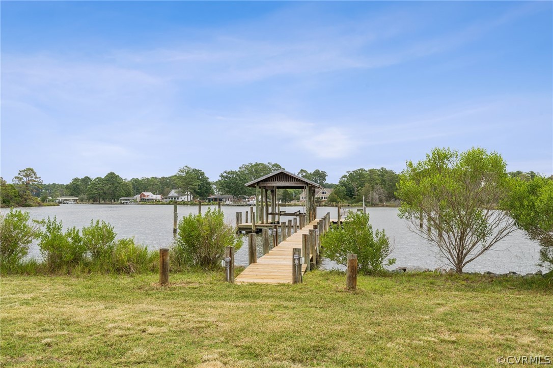 228 Field Point Road Moon, VA 23119 - Photo 38 of 49 a view of a lake with a big yard