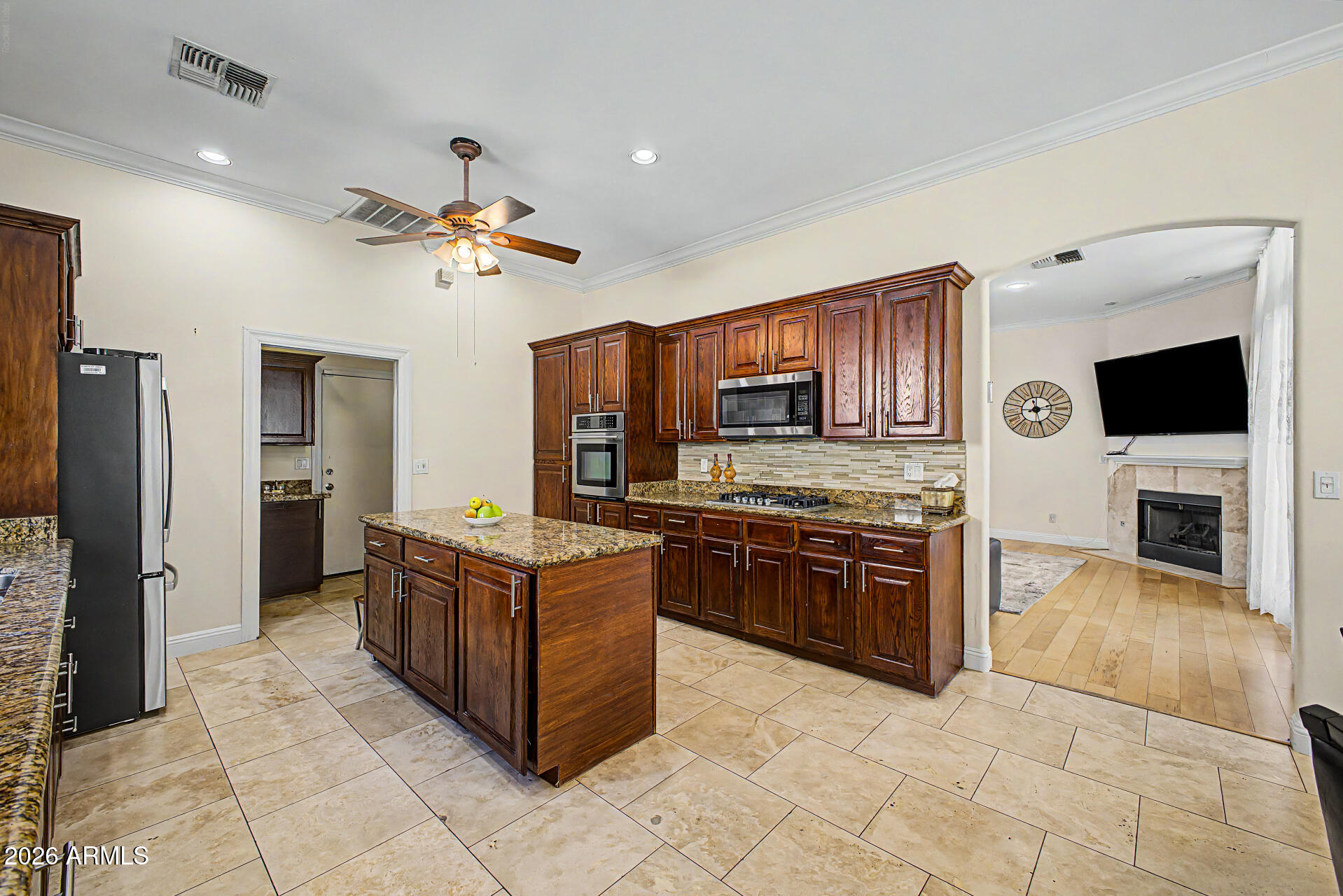 808 West Citrus Way Phoenix, AZ 85013 - Photo 13 of 35 a kitchen with stainless steel appliances granite countertop a stove refrigerator and microwave