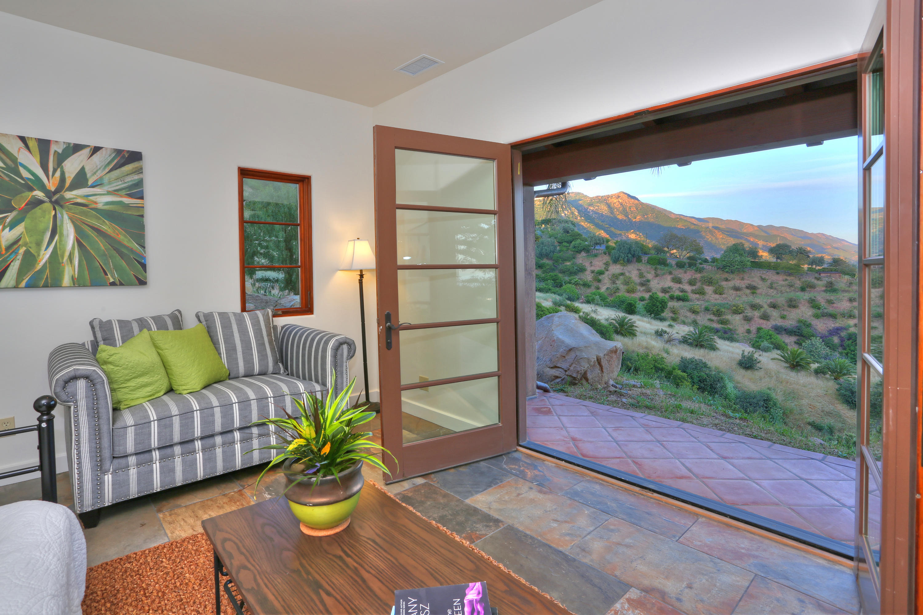 2220 Gibraltar Road Santa Barbara, CA 93103 - Photo 13 of 21 a living room with furniture and a floor to ceiling window