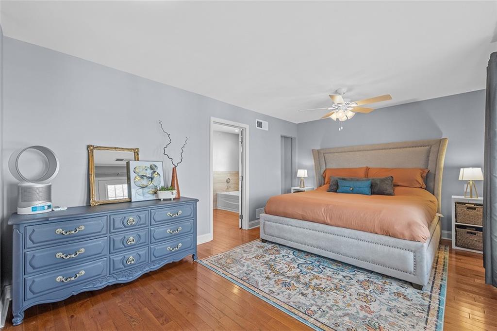 11 Natchez Street Pittsburgh, PA 15211 - Photo 12 of 25 a bedroom with a bed and wooden floor