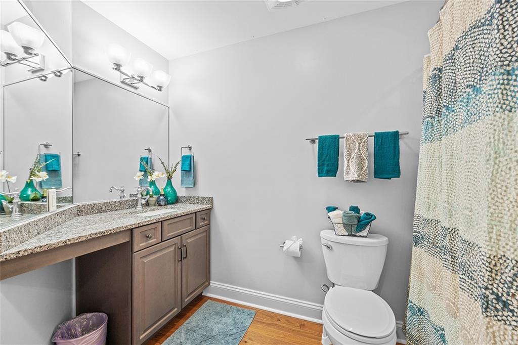 11 Natchez Street Pittsburgh, PA 15211 - Photo 17 of 25 a bathroom with a granite countertop toilet sink and mirror