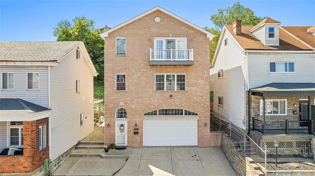 11 Natchez Street Pittsburgh, PA 15211 - Photo 2 of 25 a front view of a house with a garage
