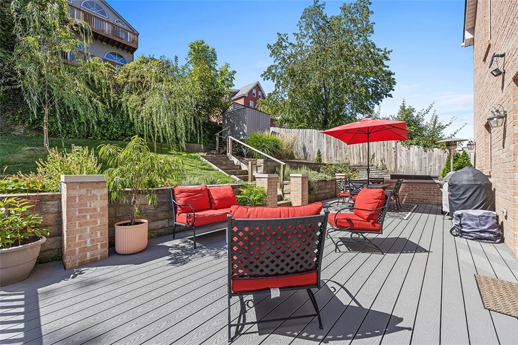 11 Natchez Street Pittsburgh, PA 15211 - Photo 22 of 25 an outdoor sitting area with furniture and wooden deck
