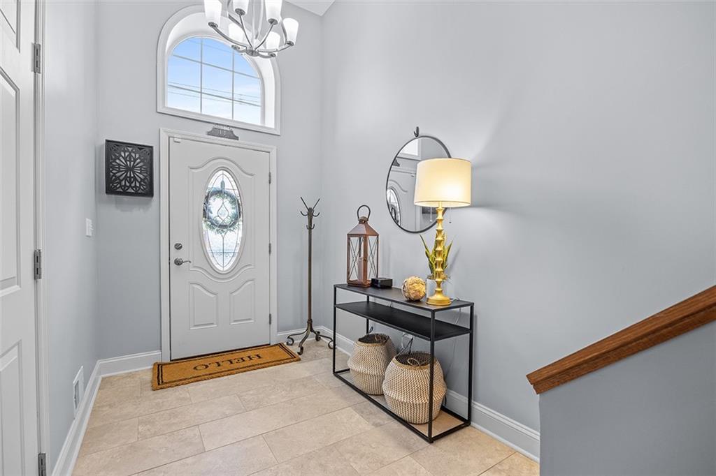 11 Natchez Street Pittsburgh, PA 15211 - Photo 4 of 25 a room with painting on the wall and a window