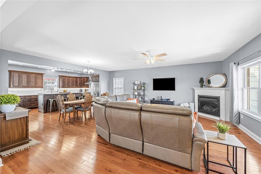 11 Natchez Street Pittsburgh, PA 15211 - Photo 5 of 25 a living room with furniture a flat screen tv and a fireplace