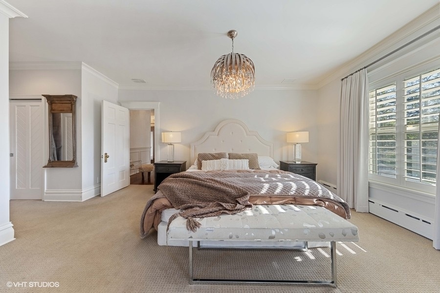 236 Melrose Avenue Elmhurst, IL 60126 - Photo 21 of 50 a bedroom with a bed and a chandelier