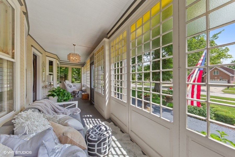 236 Melrose Avenue Elmhurst, IL 60126 - Photo 3 of 50 a balcony with furniture and a potted plant