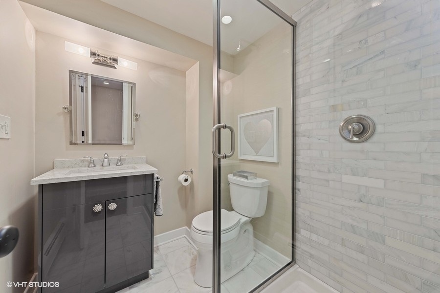 236 Melrose Avenue Elmhurst, IL 60126 - Photo 33 of 50 a bathroom with a granite countertop sink mirror and toilet
