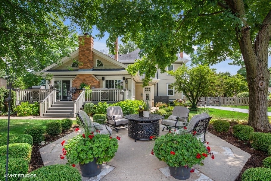 236 Melrose Avenue Elmhurst, IL 60126 - Photo 34 of 50 a view of a patio with couches chairs and a table and chairs next to a yard