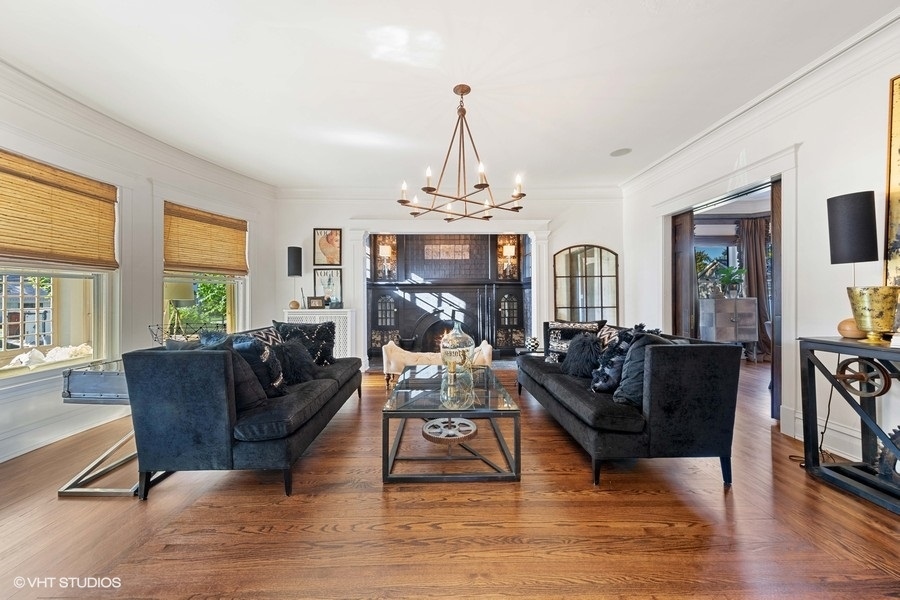 236 Melrose Avenue Elmhurst, IL 60126 - Photo 6 of 50 a living room with furniture a fireplace and a chandelier