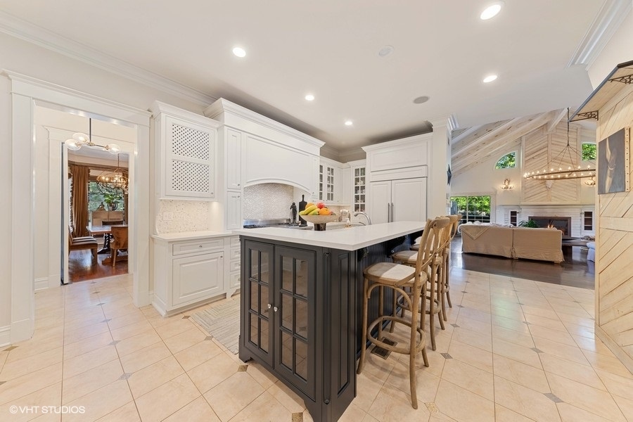 236 Melrose Avenue Elmhurst, IL 60126 - Photo 9 of 50 a kitchen with stainless steel appliances kitchen island granite countertop a table and chairs in it