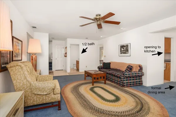 a living room with furniture a rug and a couch