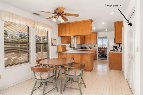 a view of a dining room with furniture window and outside view