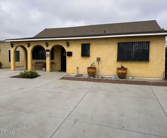 a front view of a house with parking space