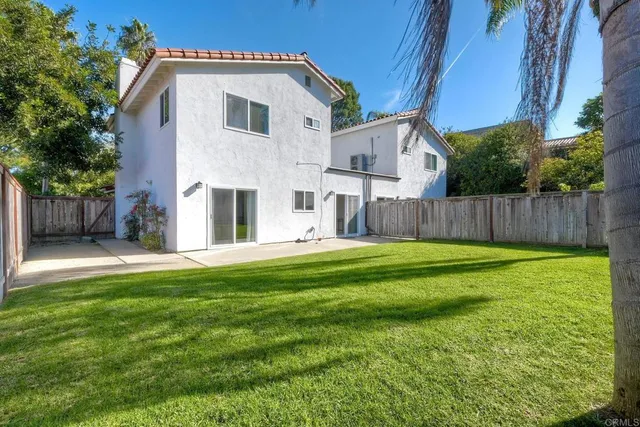 a kitchen with a sink cabinets and stainless steel appliances