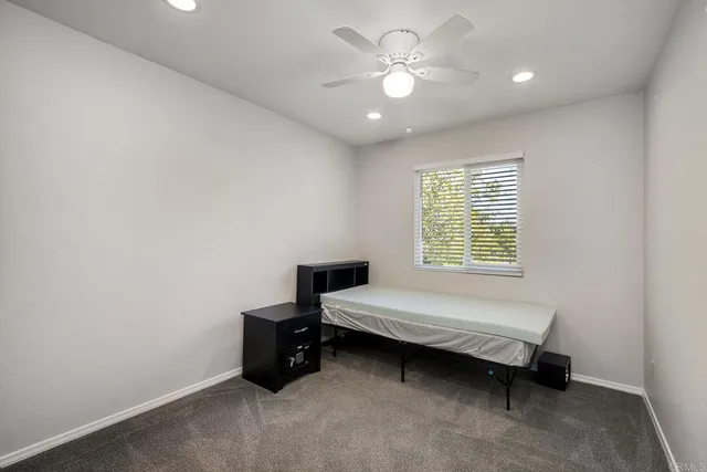 a bathroom with a toilet and shower