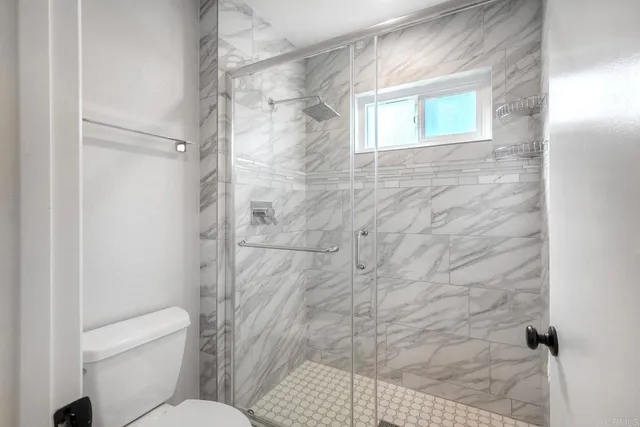 a kitchen with a sink cabinets and microwave