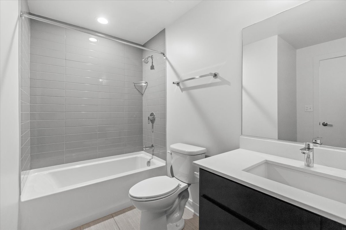 500 North Northwest Highway, Unit 111 Park Ridge, IL 60068 - Photo 9 of 12 a bathroom with a sink a toilet and a bathtub