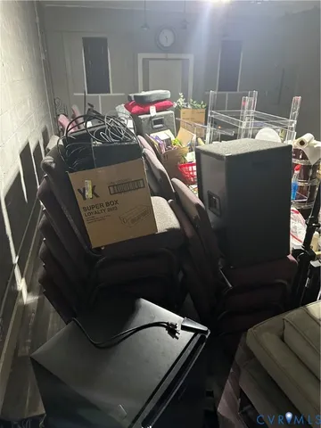 a living room with dining table and chairs