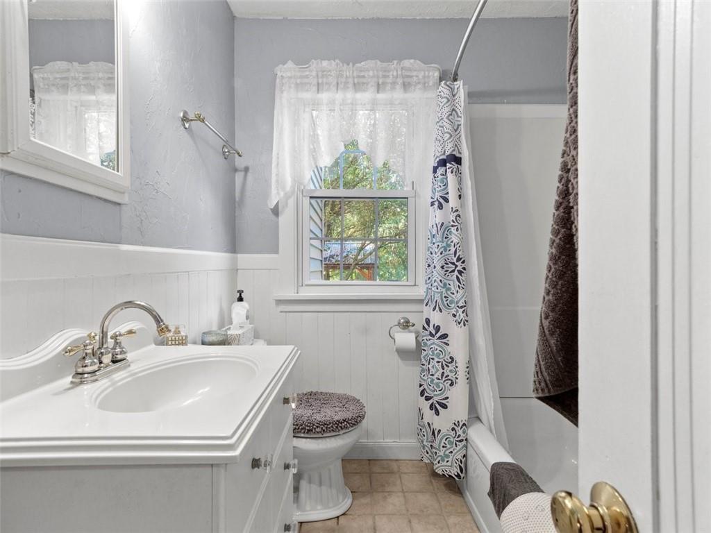 360 Dappenbrook Drive Beaver, PA 15009 - Photo 17 of 30 a bathroom with a sink a toilet and a shower curtain