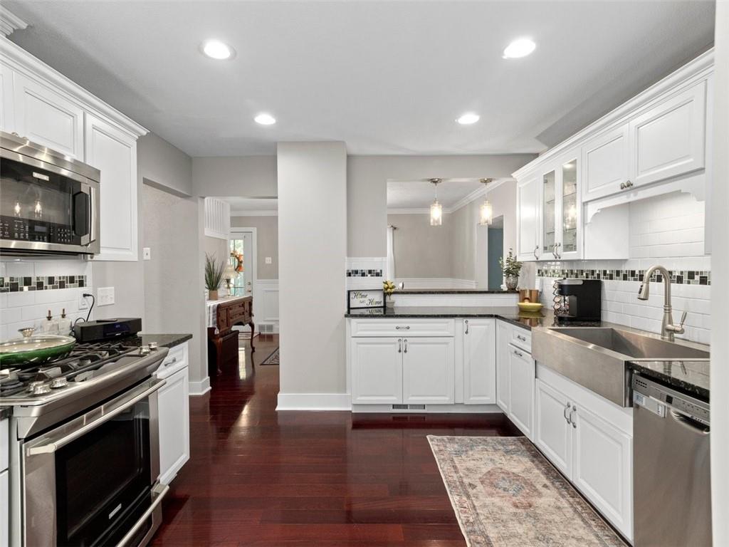 360 Dappenbrook Drive Beaver, PA 15009 - Photo 3 of 30 a large kitchen with stainless steel appliances granite countertop a sink and dishwasher a stove top oven with wooden floor