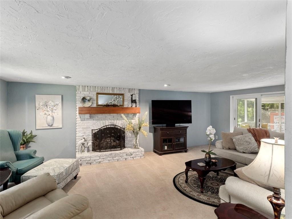 360 Dappenbrook Drive Beaver, PA 15009 - Photo 8 of 30 a living room with furniture a fireplace and a flat screen tv